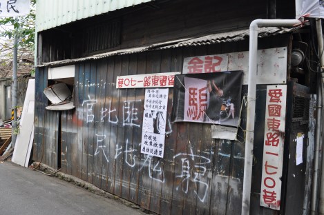 a resident uses graffiti in protest/huaguang community, taipei/feb 3, 2013